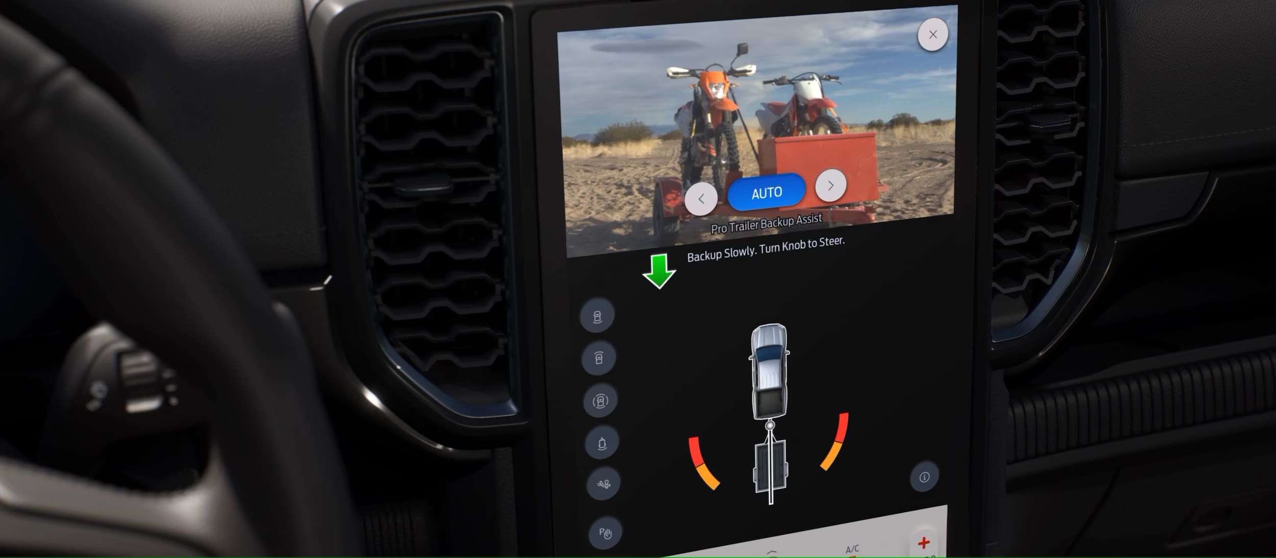 The dashboard screen showing the backup camera and safety features.