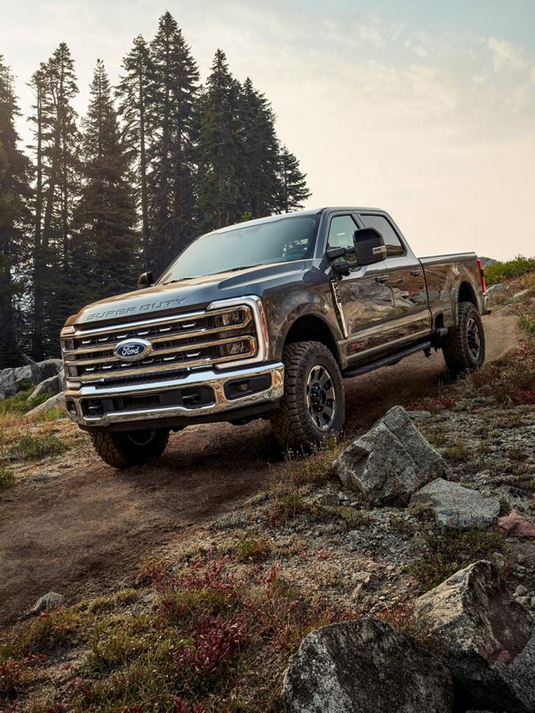 Ford Super Duty truck descending a steep rocky hill displaying extreme off-road capability