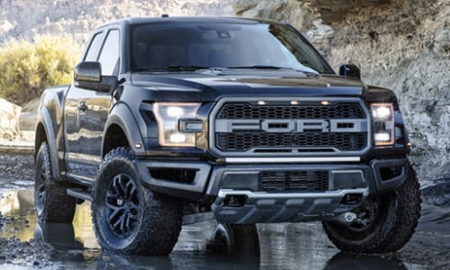 2020 Ford F150 Raptor black sitting mud and water
