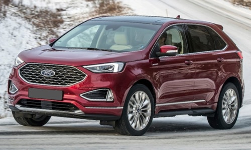2020 Ford Edge red in-motion curvy mountain highway snow