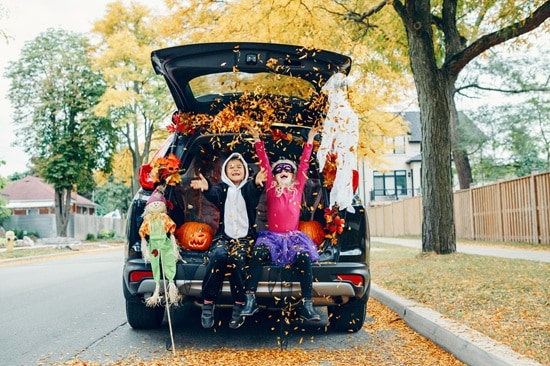 Family%20Celebrating%20Halloween%20in%20Trunk%20of%20Car.jpg