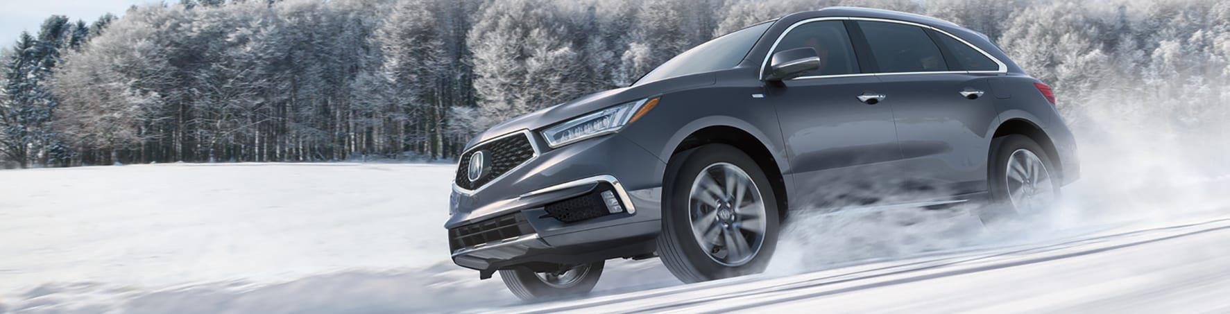 Acura driving in snow.