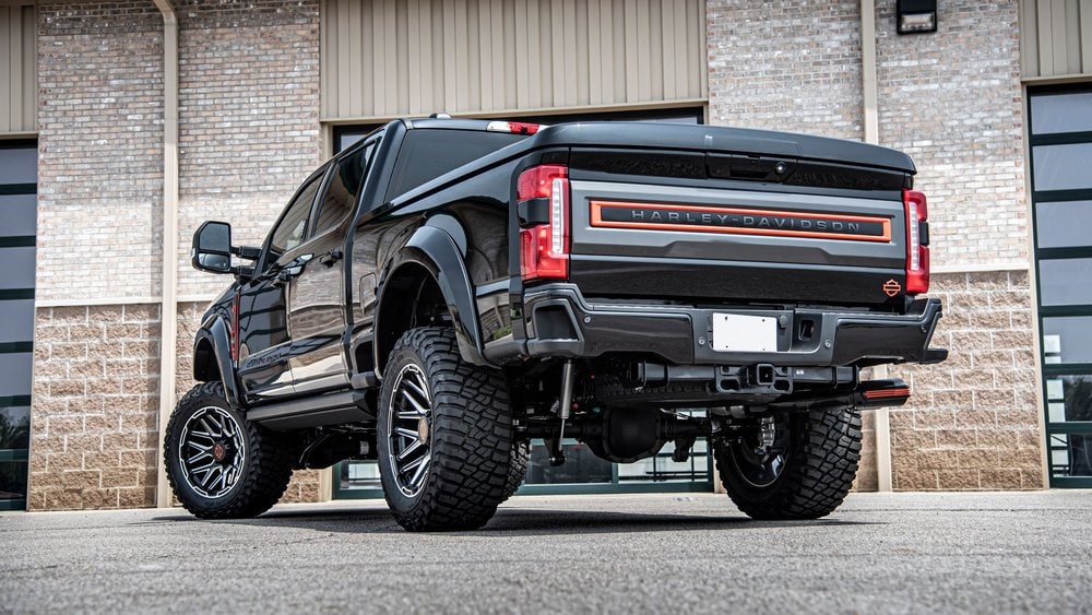  Person cheerfully signing documents.