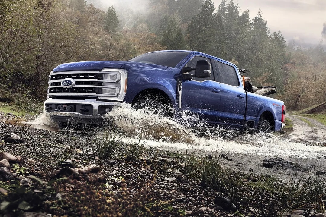 2026 Ford Super Duty driving through water puddle
