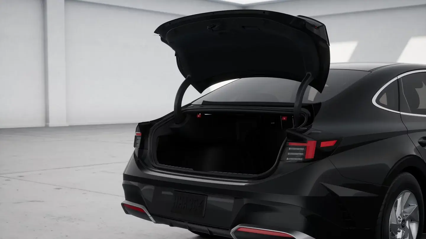 Black Hyundai Sonata SE with the trunk open, rear three-quarter view