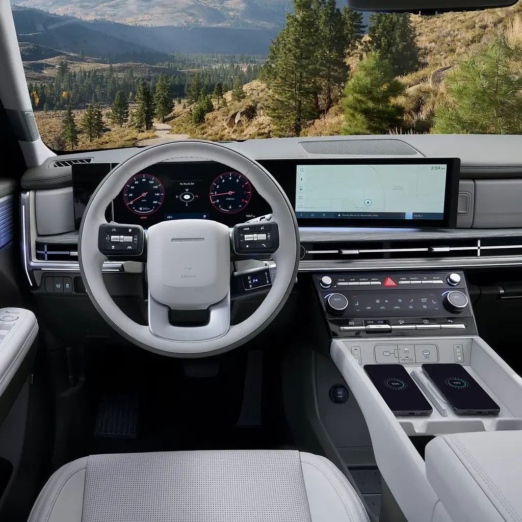 Hyundai Santa Fe Hybrid center console with the shifter, wireless charging pad, USB-C outlets and dual-zone climate controls