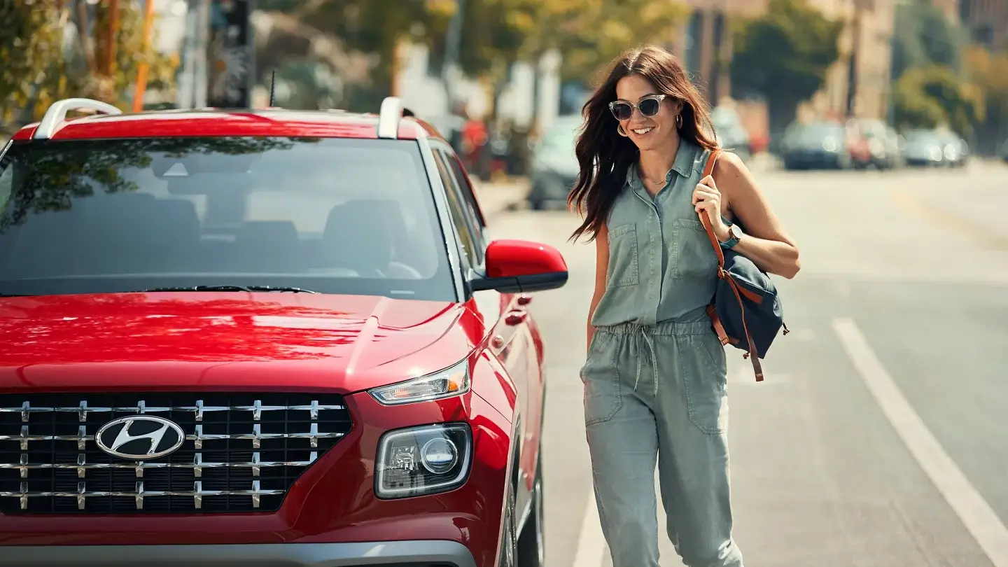 Hyundai Venue subcompact SUV parked on a city street, front three-quarter view
