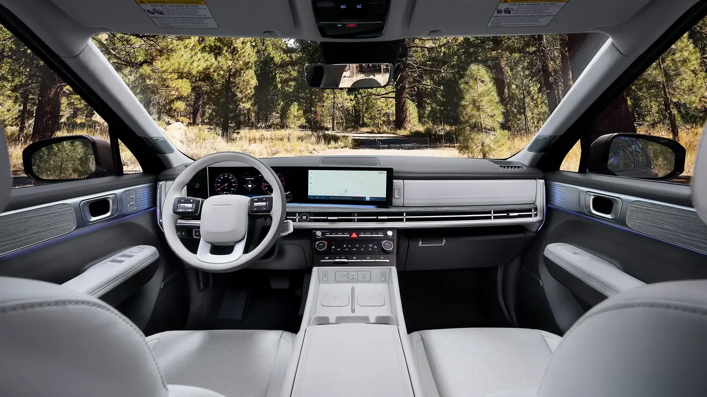 Hyundai Santa Fe Hybrid interior showing the Panoramic Curved Display combining the digital gauge cluster and touchscreen