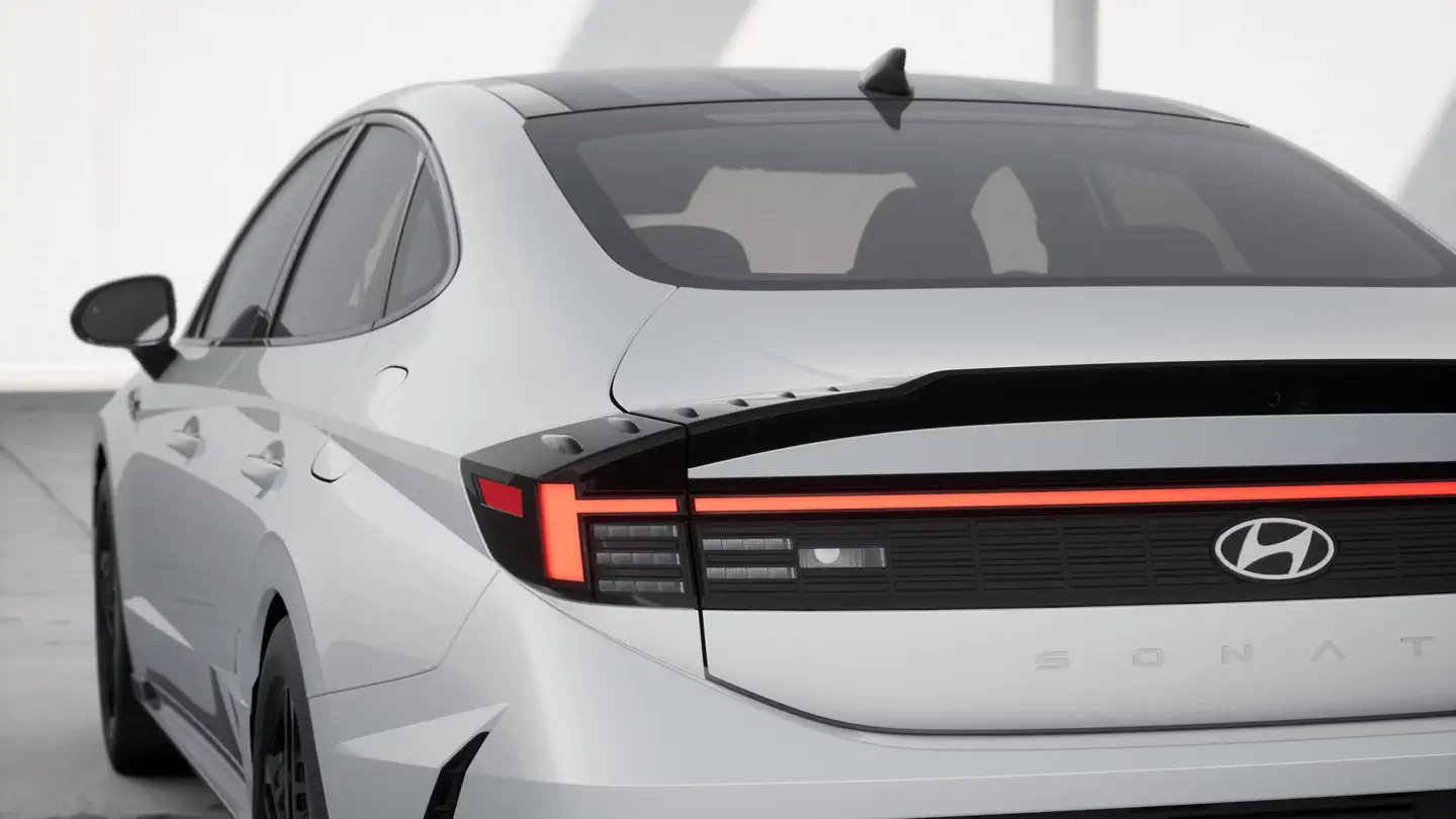 White Hyundai Sonata N Line rear spoiler and full-width taillight, close-up