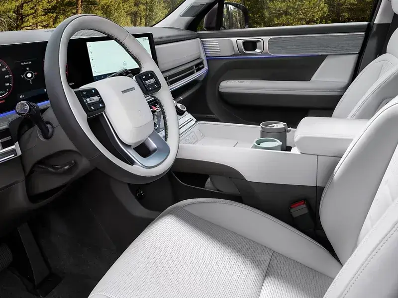 View of the Hyundai Santa Fe Hybrid dashboard and center console from the driver seat