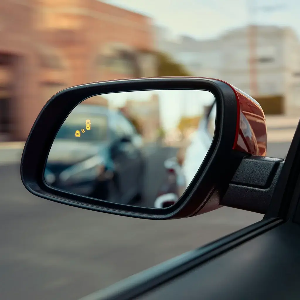 Blind-Spot Collision Warning indicator illuminated in the Hyundai Venue side mirror
