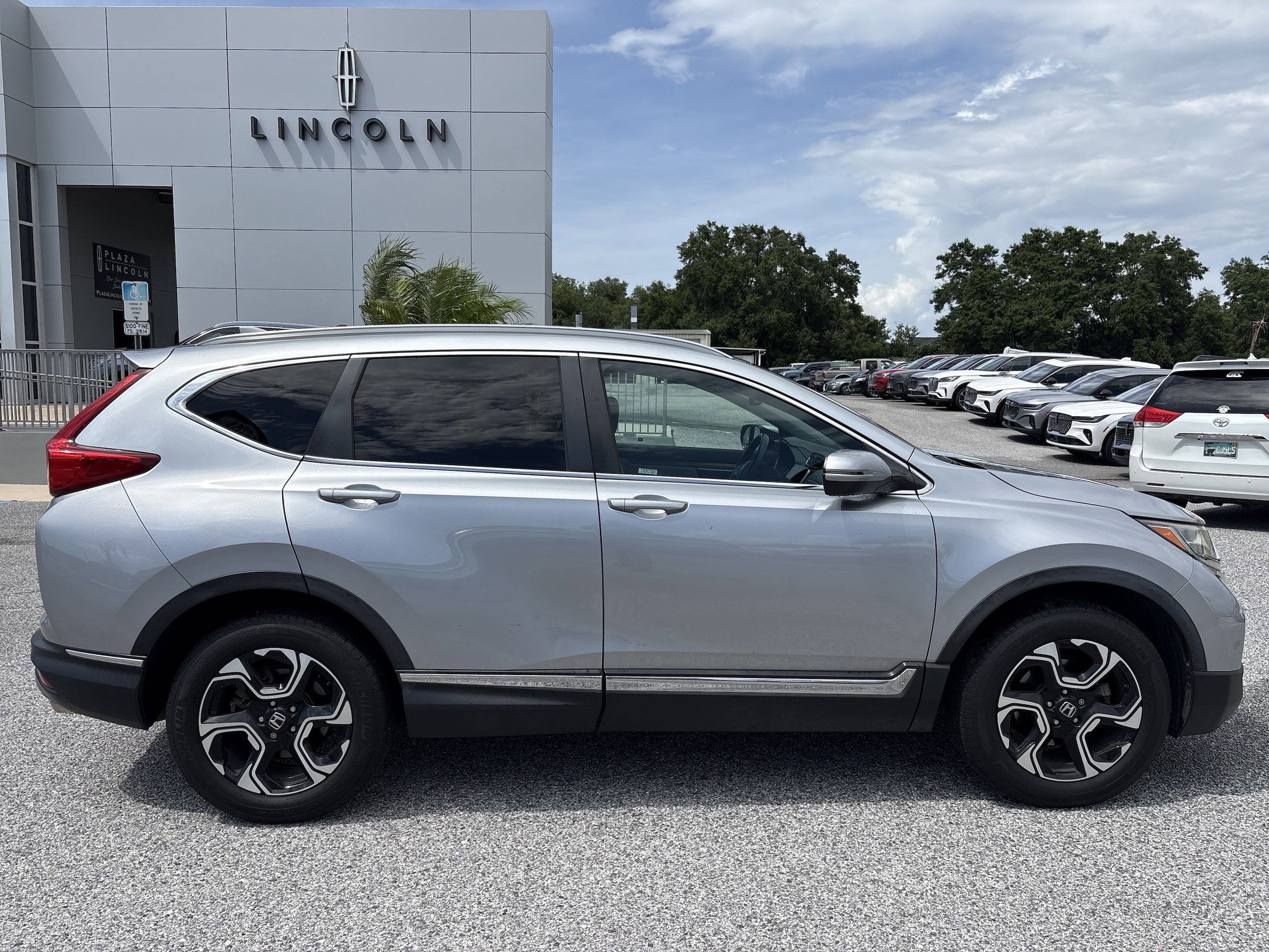 Used 2017 Honda CR-V Touring with VIN 2HKRW2H97HH633758 for sale in Leesburg, FL