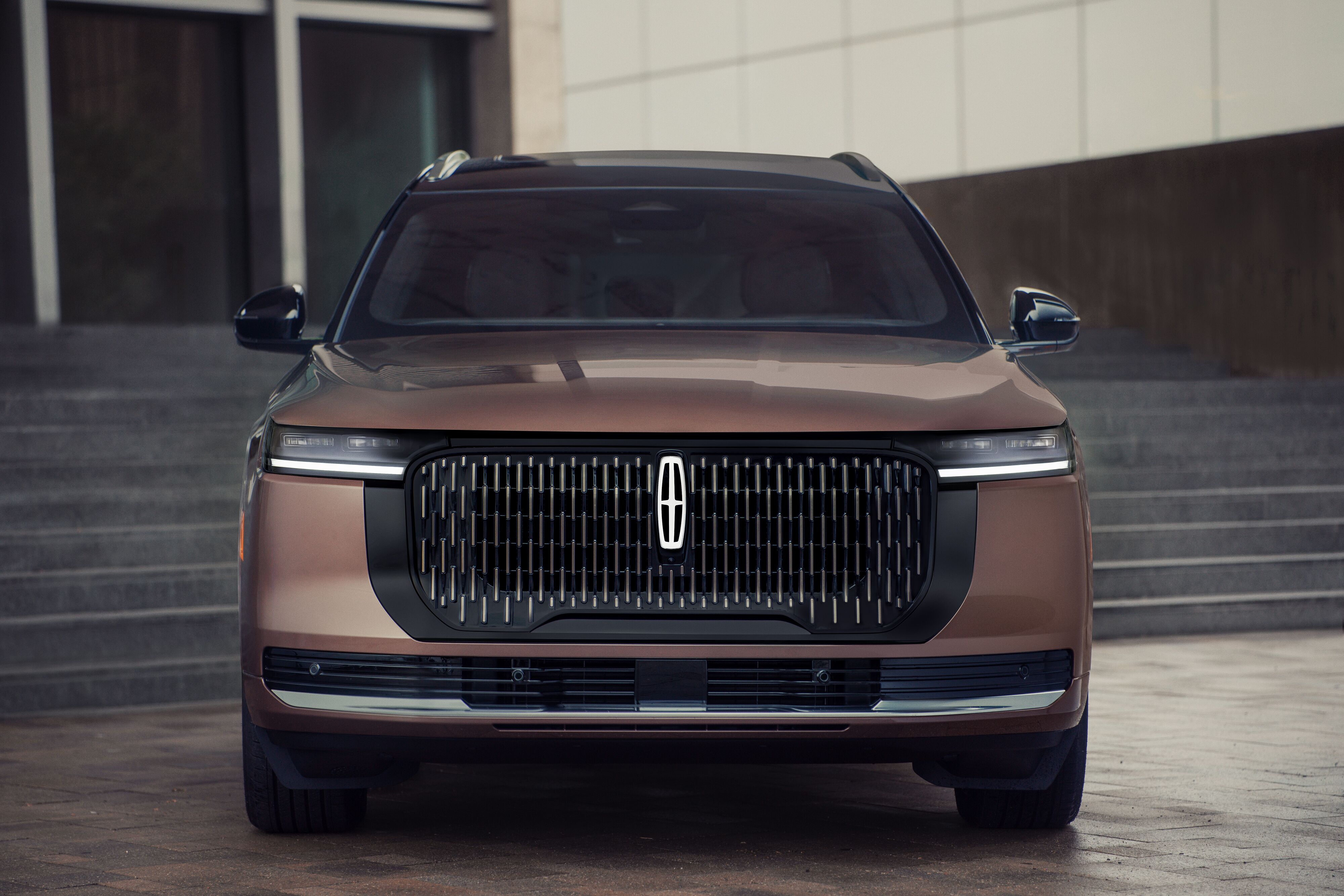 Close-up front view of the 2027 Lincoln Nautilus showcasing the illuminated emblem, signature front grille, and LED light bar.