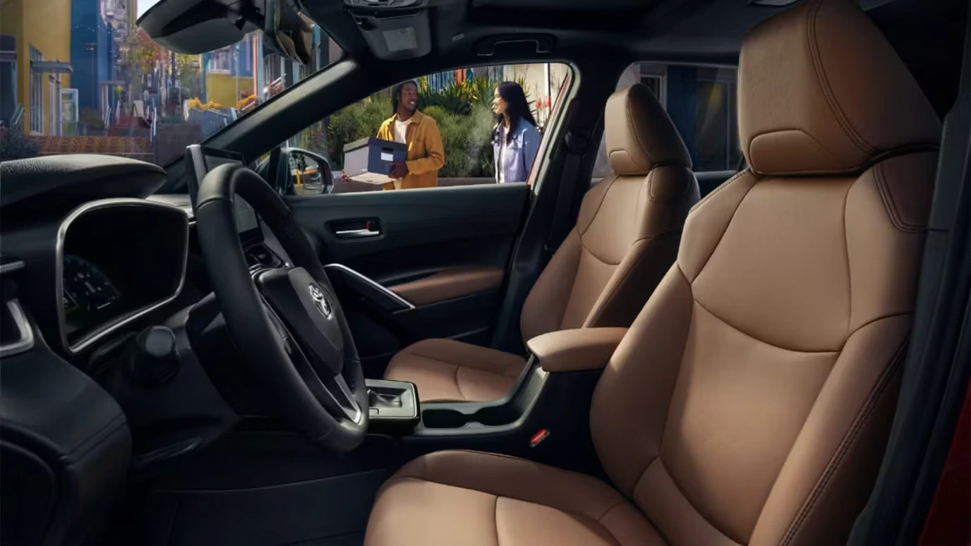 Corolla Cross XLE interior shown in Portobello SofTex trim with driver and passenger seats
