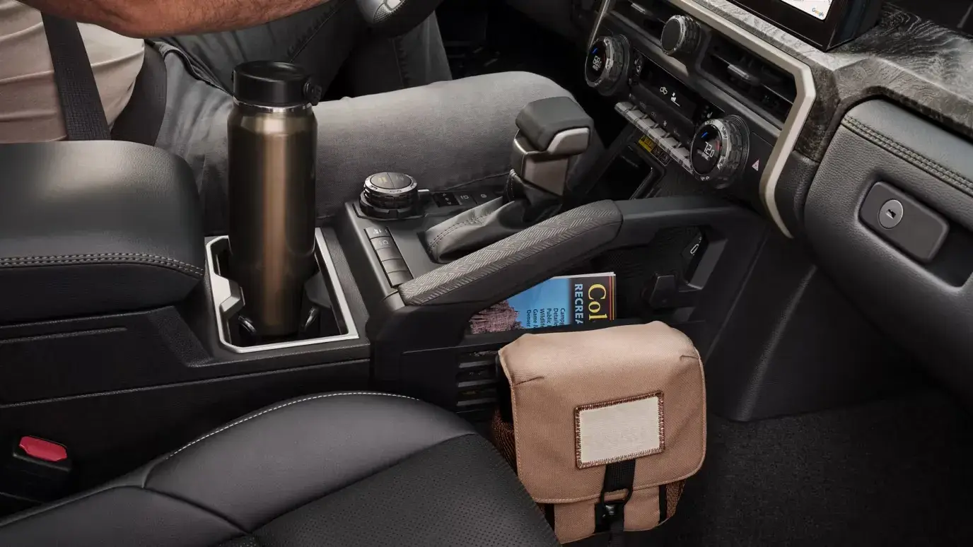 Toyota Tacoma center console with gear selector, cupholders and armrest storage