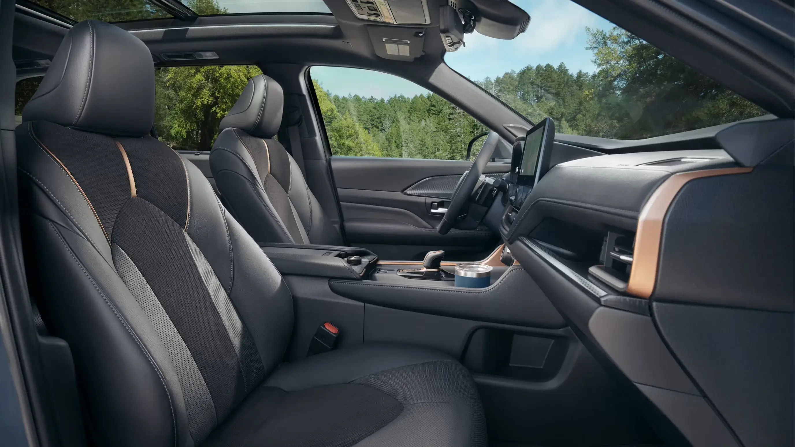 Toyota Grand Highlander front seats in black leather with the 12.3-inch touchscreen