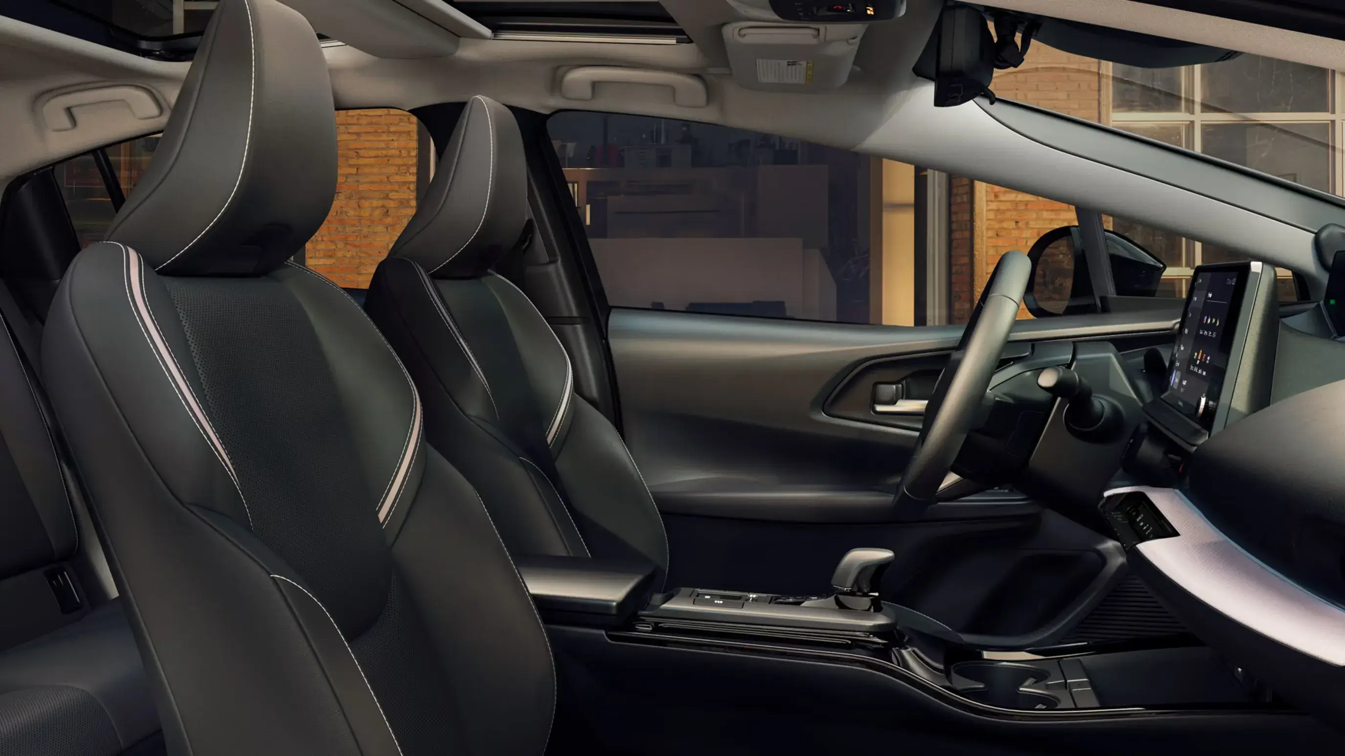 2027 Toyota Prius cabin viewed from the front passenger side showing seats and console