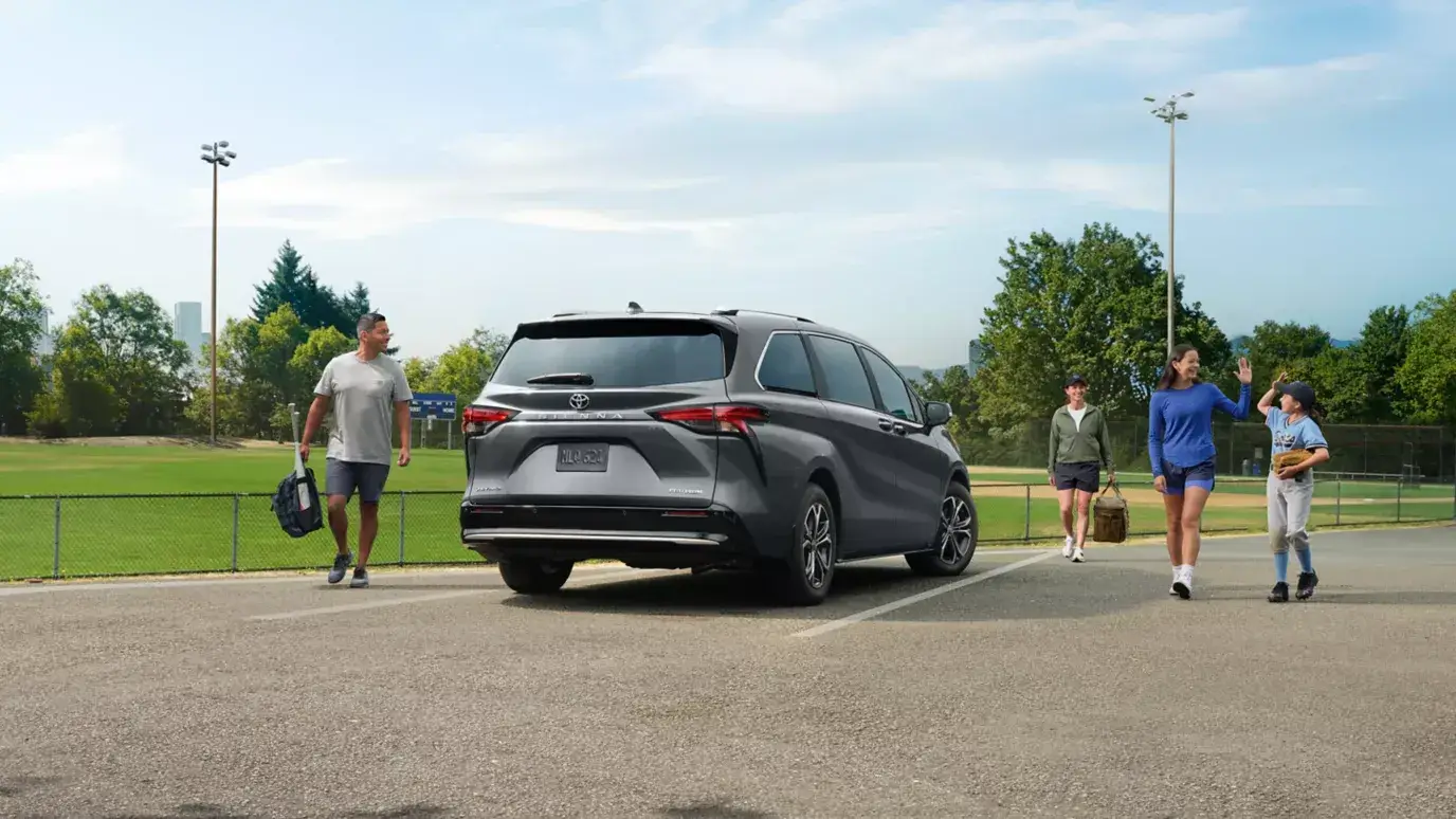 Rear three-quarter view of the Toyota Sienna showing tail lights and rear liftgate