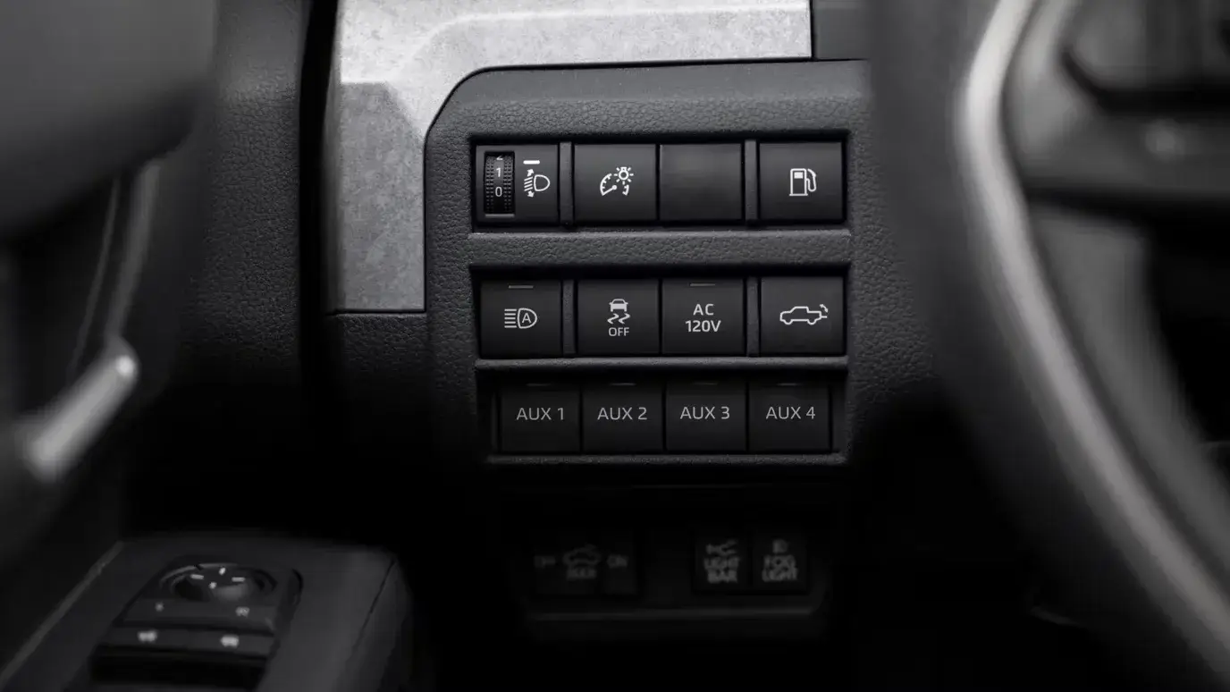Toyota Tacoma dashboard switches for headlights, tailgate release, 120-volt AC power and ABS off