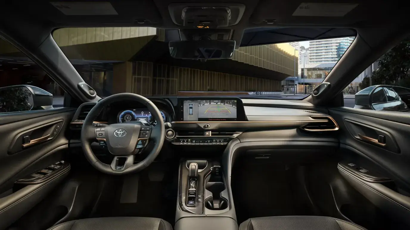 Toyota Crown Signia dashboard showing the 12.3-inch touchscreen, steering wheel and physical climate controls