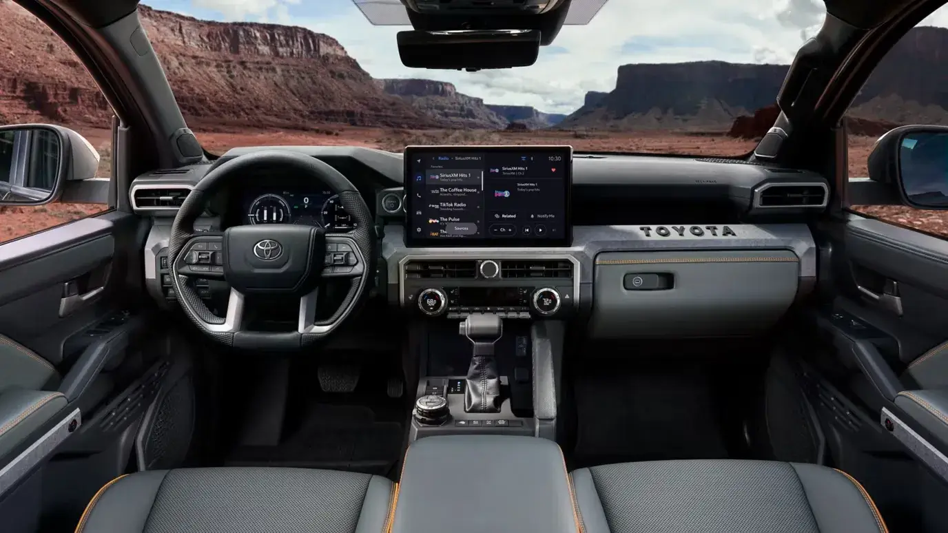 Toyota Tacoma i-FORCE MAX interior with the touchscreen, steering wheel and center controls