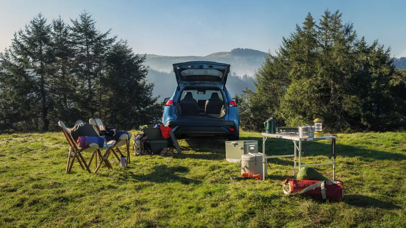 Open cargo area of a Toyota Corolla Cross loaded with gear on an outdoor trip