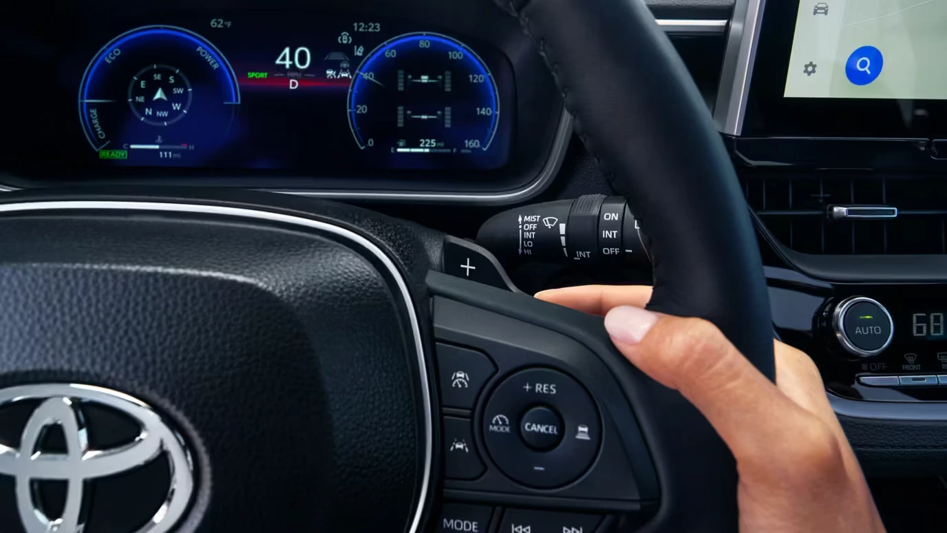 Toyota Corolla Cross steering wheel with controls and digital driver display behind it