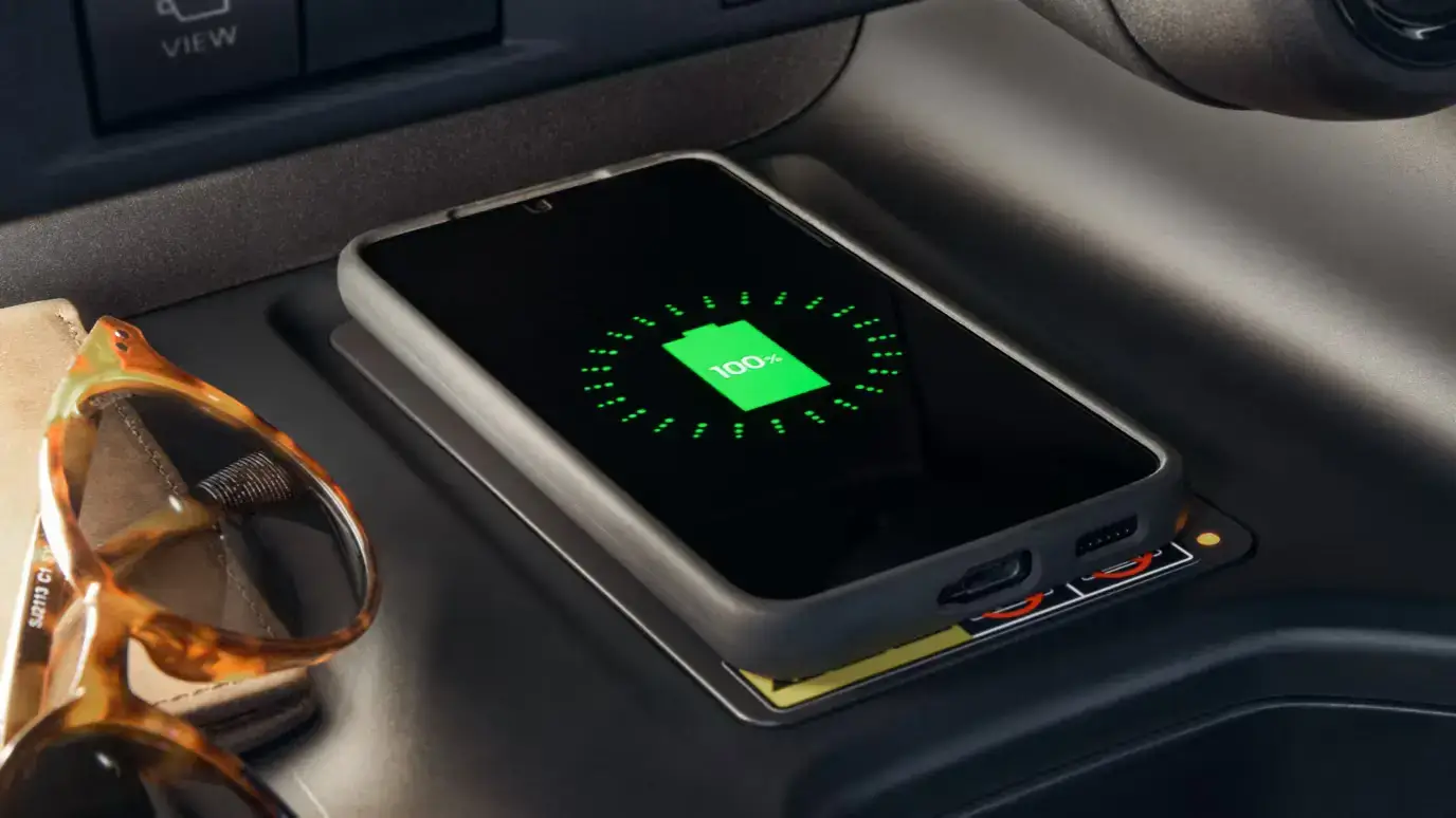 Qi-compatible wireless charging pad in the center console of a Toyota Grand Highlander