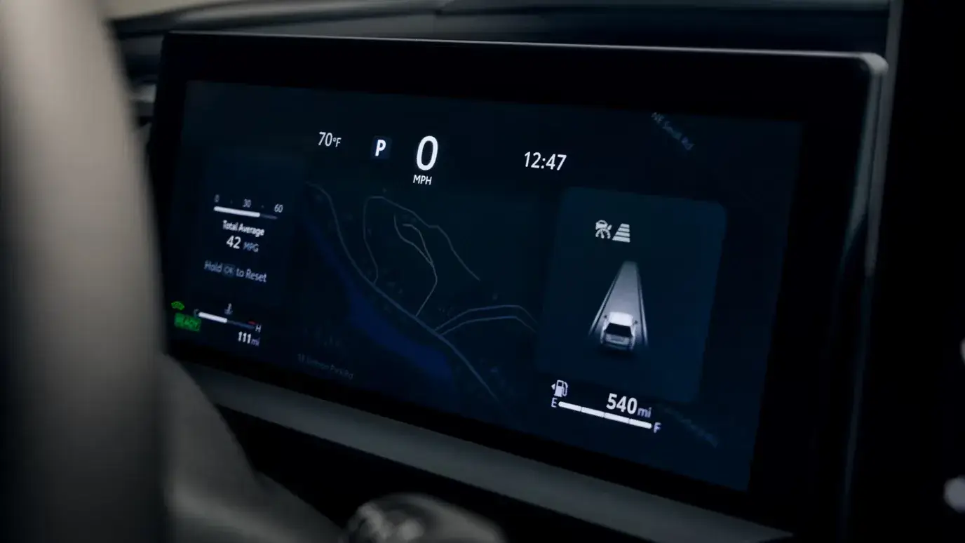 Toyota RAV4 digital gauge cluster displaying speed and hybrid system information