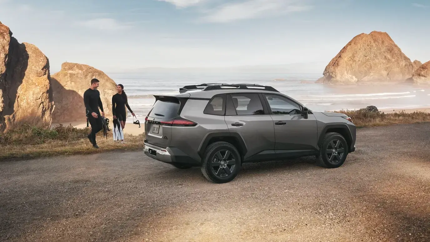 Passenger-side profile of the Toyota RAV4 showing squared wheel arches and alloy wheels