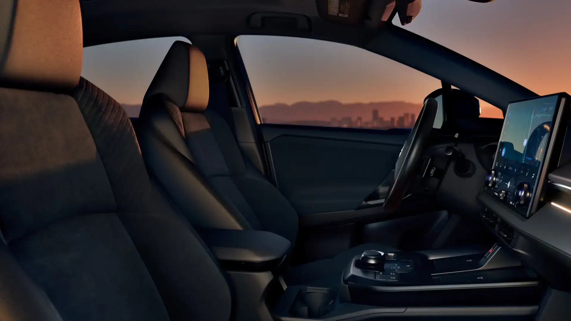 2027 Toyota C-HR cabin viewed from the passenger side showing soft-touch materials and ambient lighting