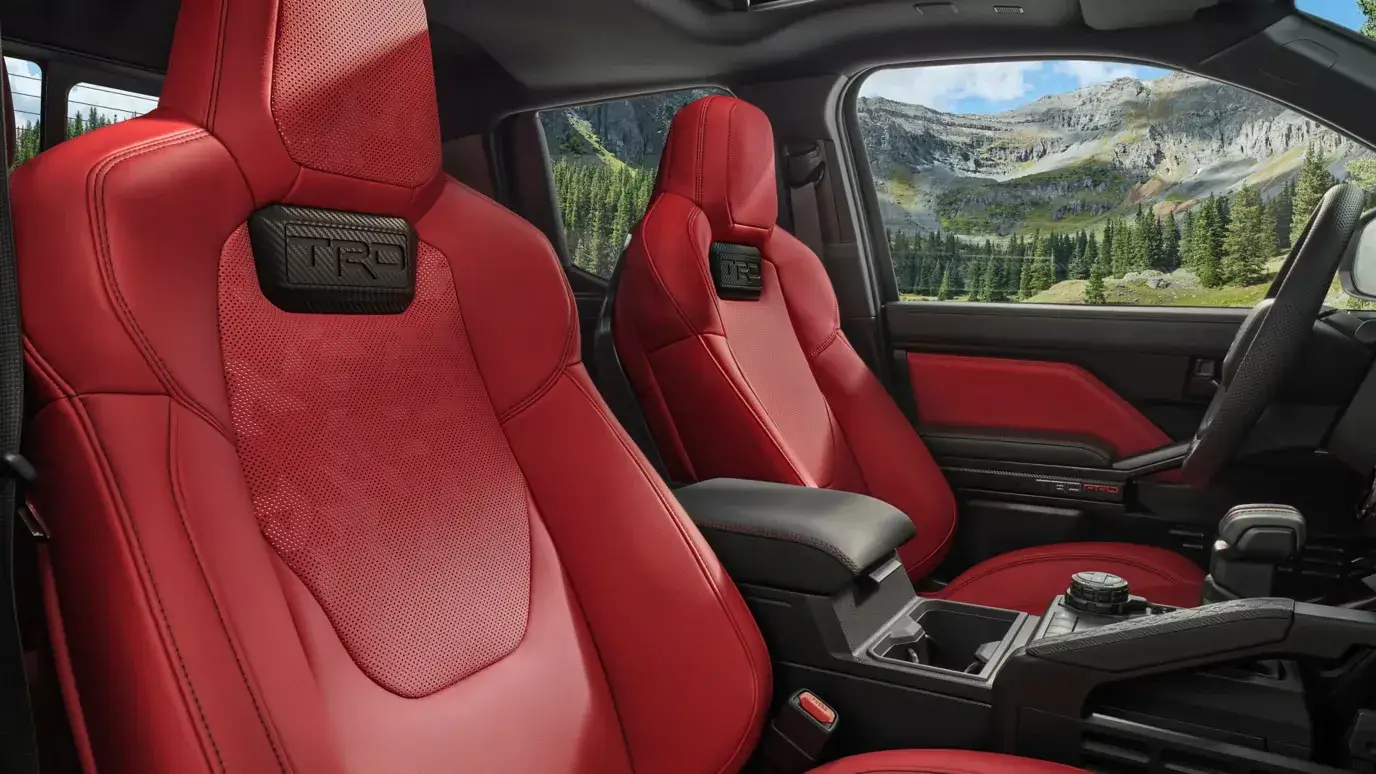 Red TRD front seats inside a Toyota Tacoma i-FORCE MAX