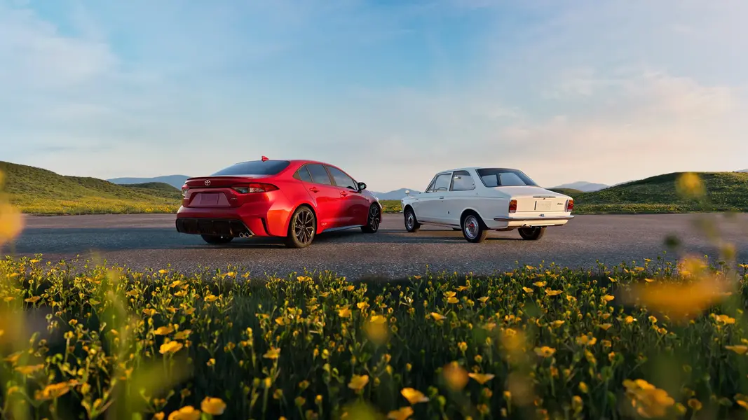 Rear three-quarter view of the 2027 Toyota Corolla showing tail lights and rear diffuser