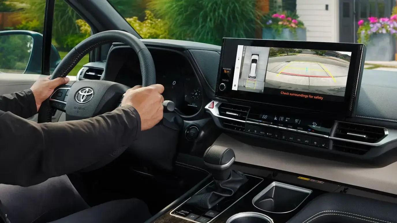 Toyota Sienna touchscreen displaying the backup camera view while reversing