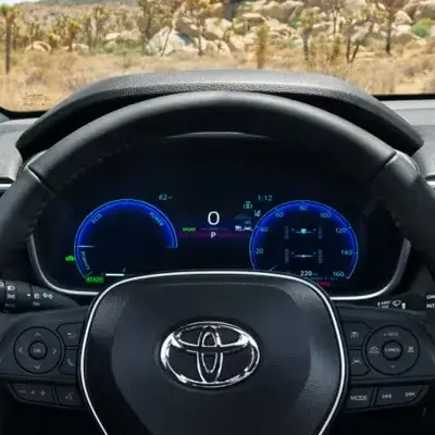 Driver's view of the Toyota Corolla Cross dashboard and digital instrument cluster
