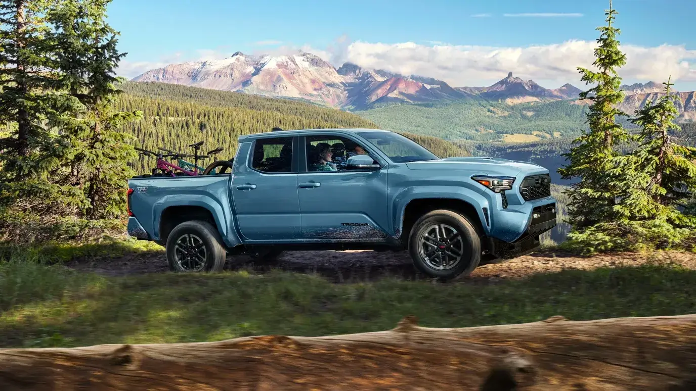 2027 Toyota Tacoma in blue shown in passenger-side profile