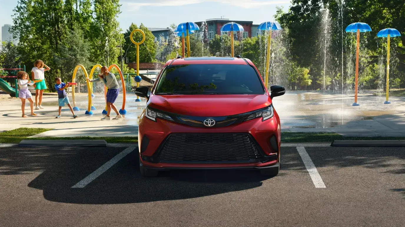 Toyota Sienna viewed straight on from the front showing the full-width lower grille
