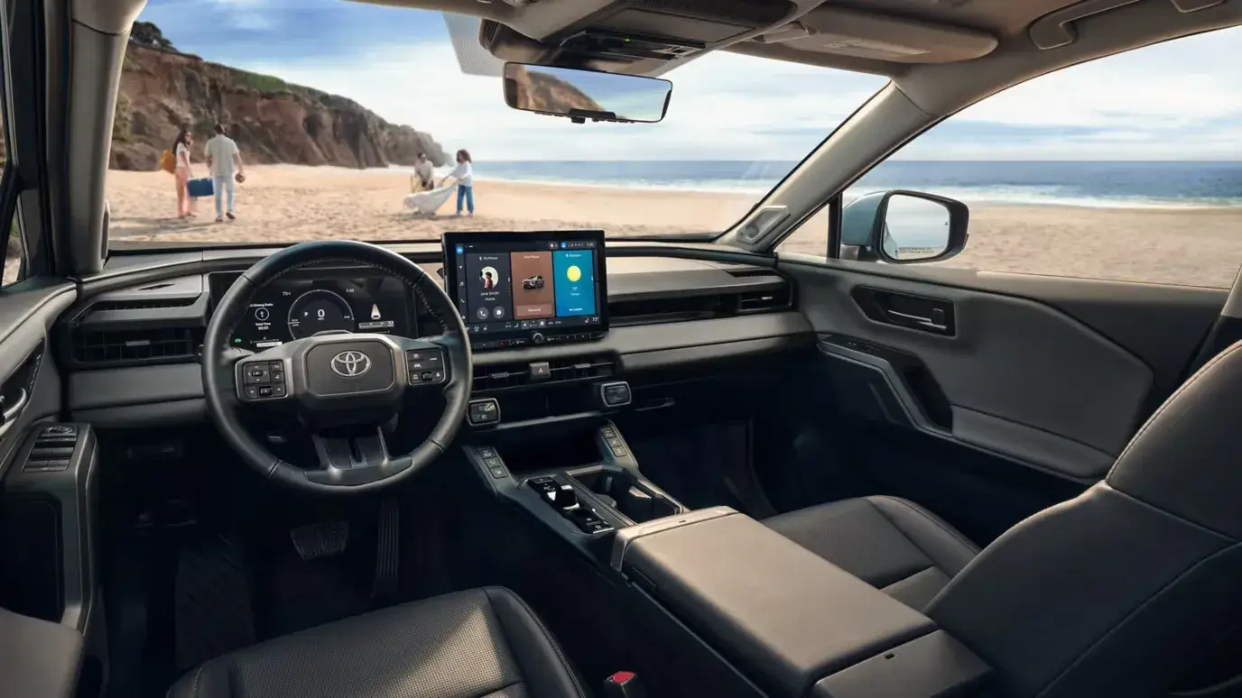 Toyota RAV4 interior showing the tiered dashboard, center console and front seats