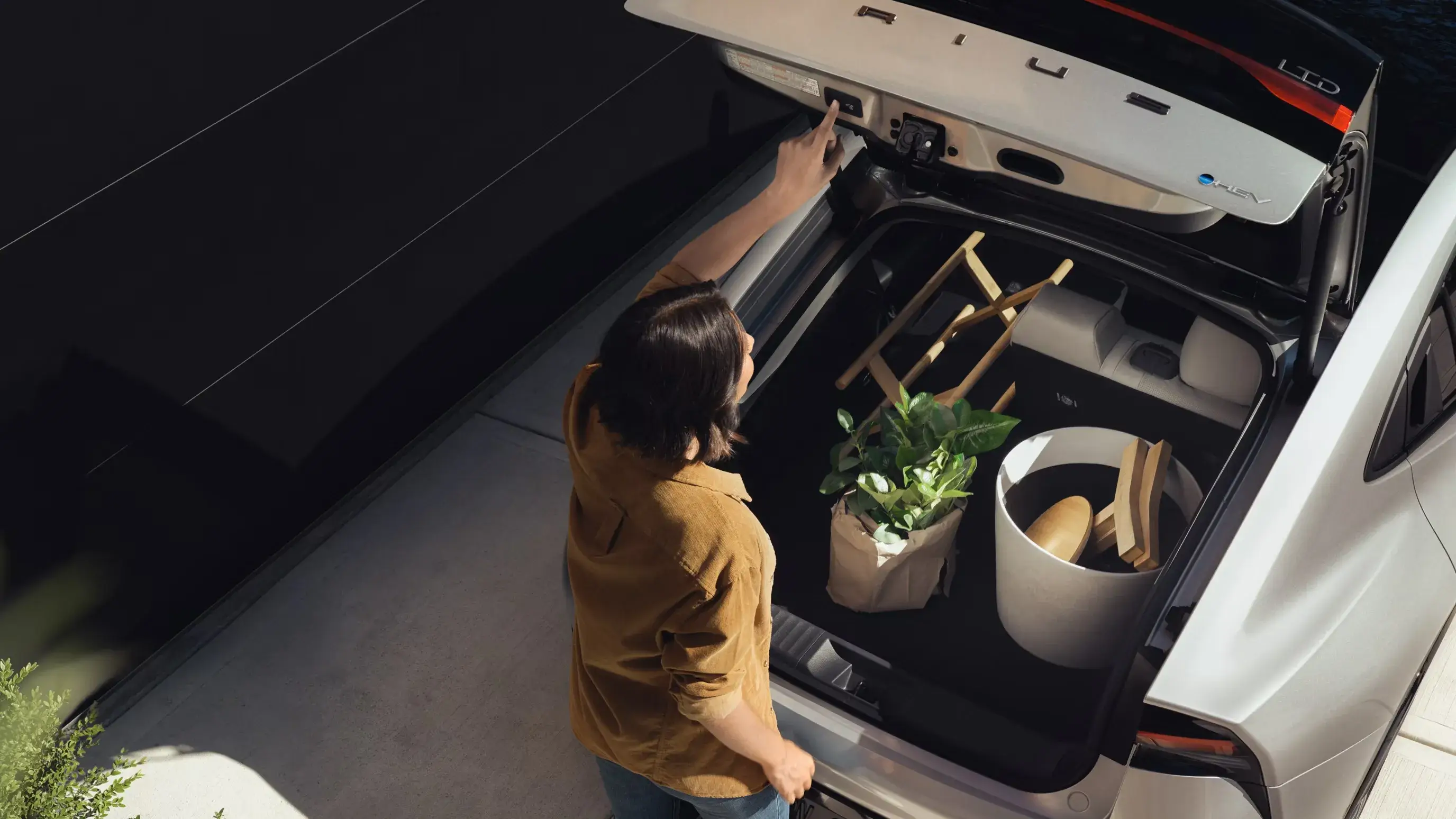 2027 Toyota Prius cargo area behind the rear seats with the liftback open