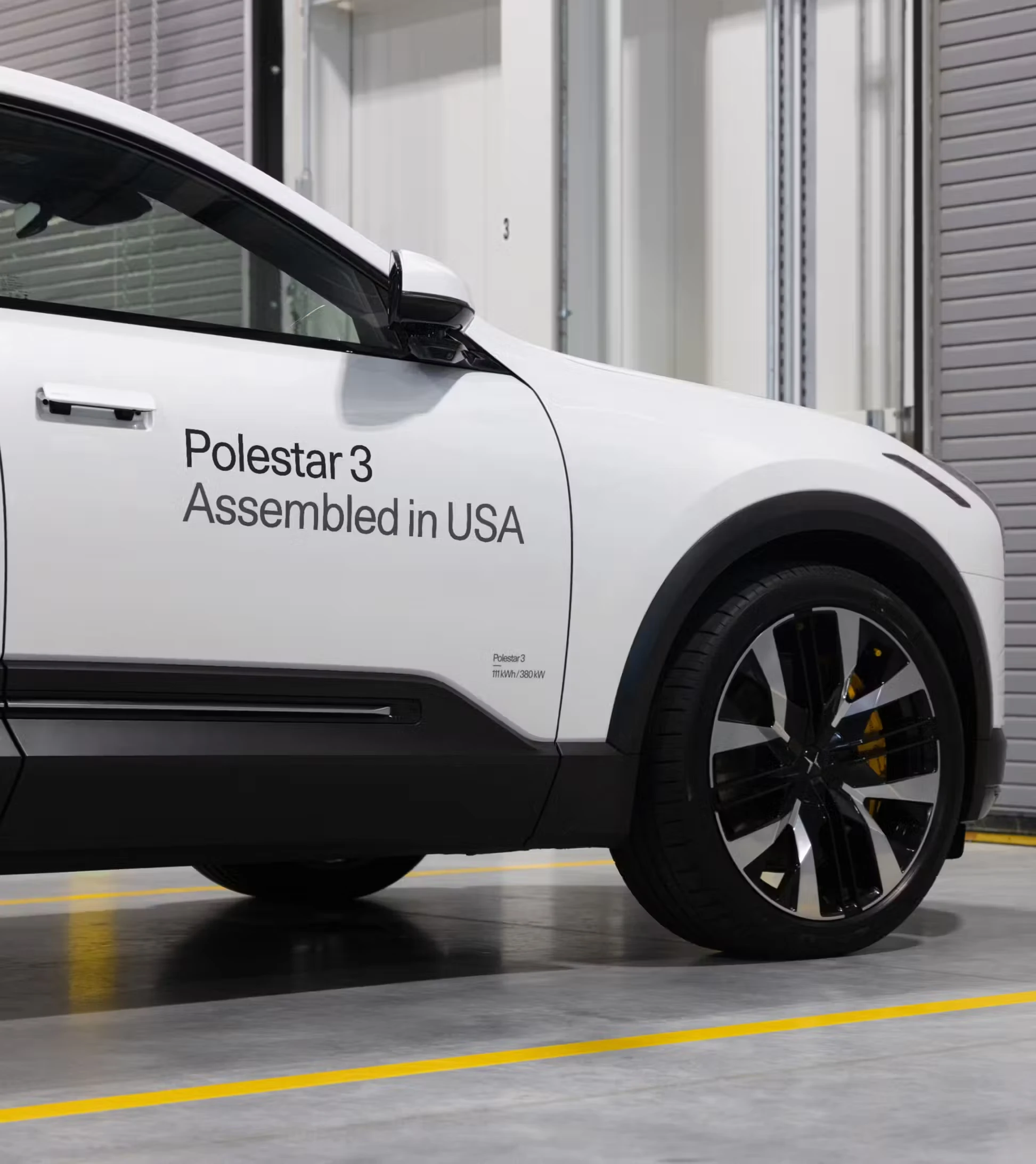 Front left corner view of a Polestar 3 on the assembly floor