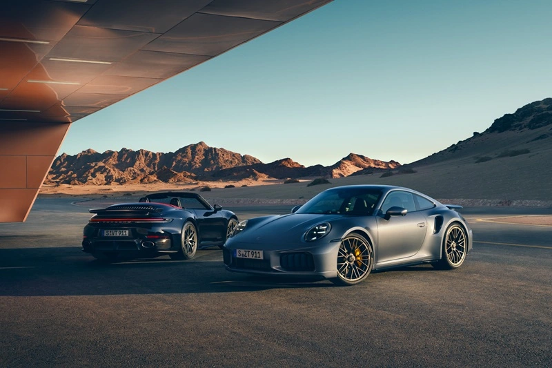 Porsche 911 and Porsche 911 Convertible with top down side by side