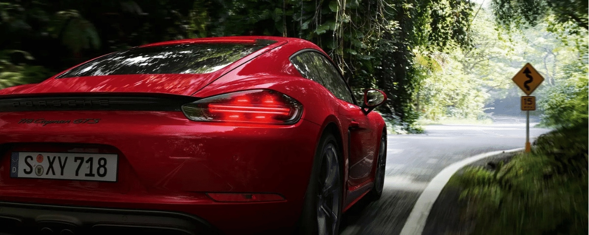 Porsche 718 GTS driving down a windy road