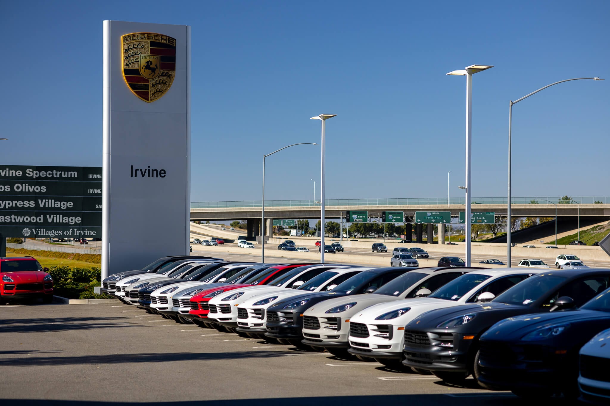 View of the well-stocked, well-lit car lot at Porsche Irvine