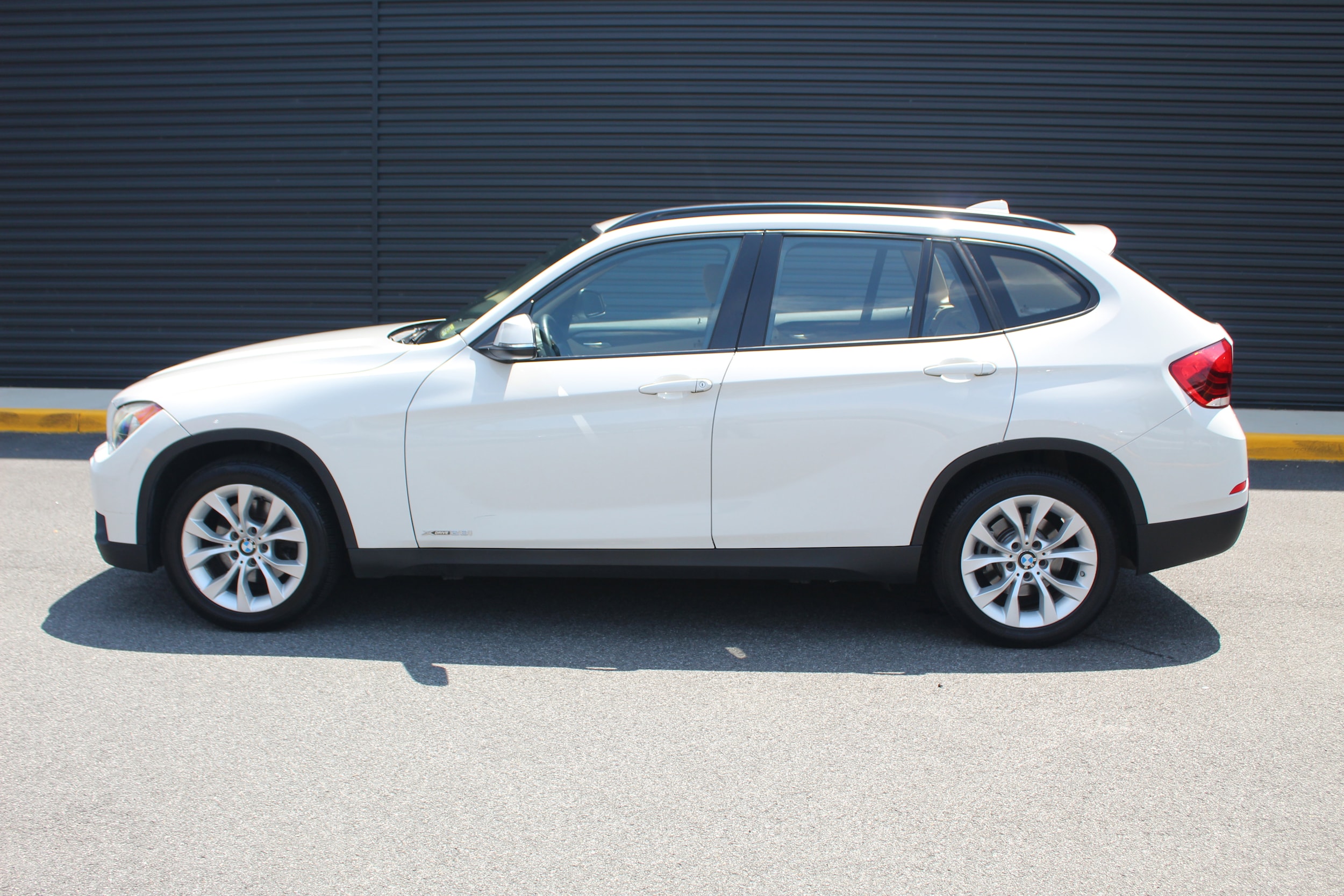 Used 2014 BMW X1 28i with VIN WBAVL1C52EVY14507 for sale in Arlington, VA