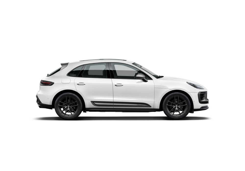 Driver's side view of a new Porsche Macan SUV in front of a white background
