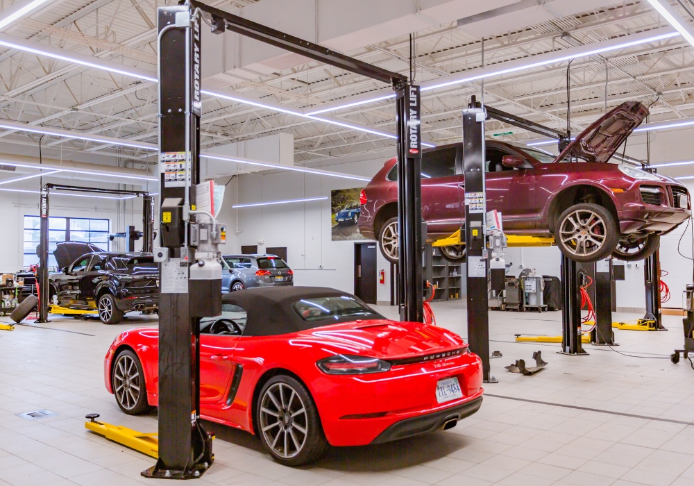 Porsche Charlottesville service center with several Porsche cars being serviced
