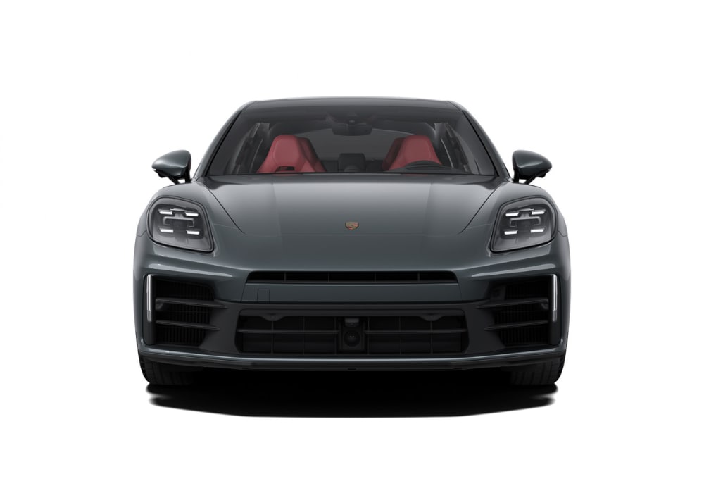 Black 2025 Porsche Panamera in front of a white background. The interior of the car is red.