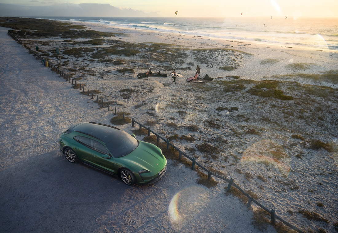 2023-Porsche-Taycan-TurboSCrossTurismo-Sedan-L07.png green Porsche Taycan parked at the beach, overhead view