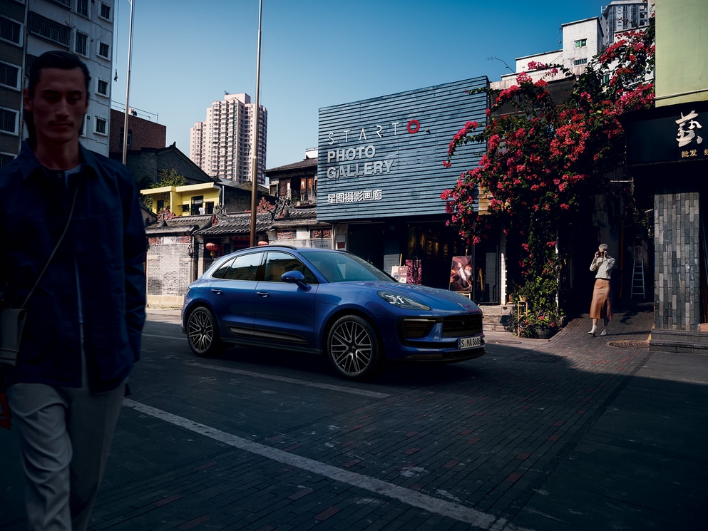 Porsche Macan outside of a store.png