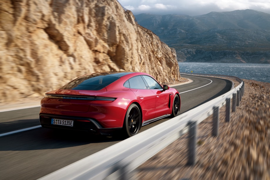 2023 Porsche Taycan driving near the water.png